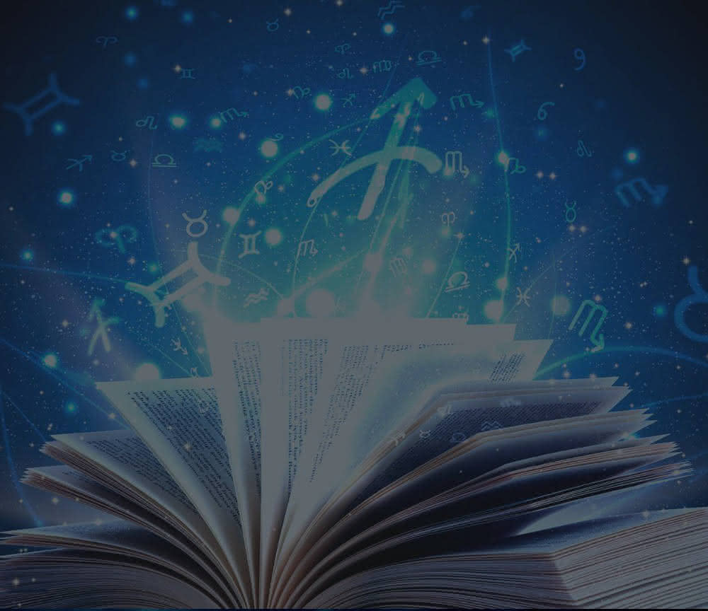 An open book, with the signs of the zodiac rising from its pages